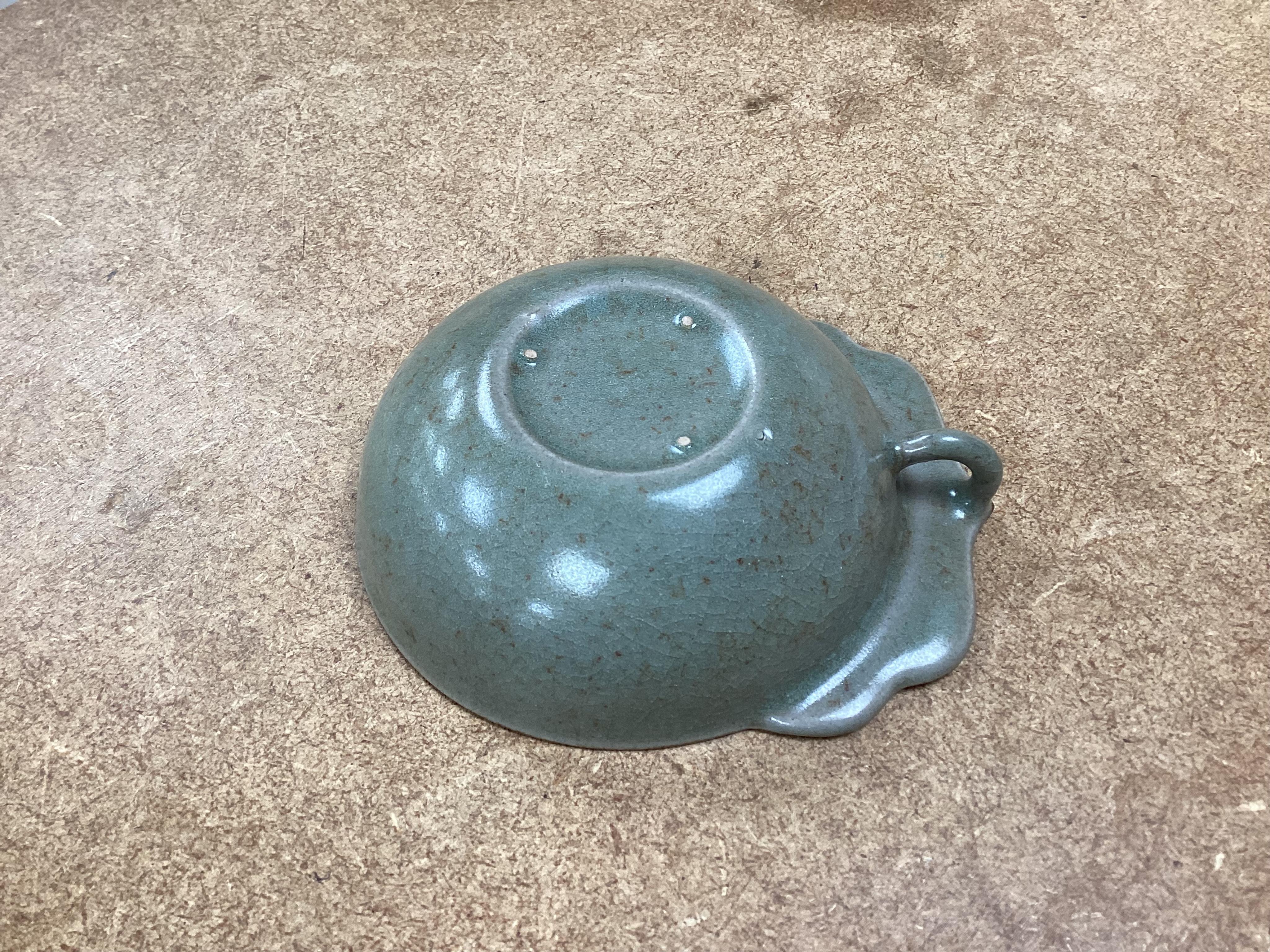 A collection of Chinese porcelain and pottery to include a naturalistic teapot, crackle glaze bowl and a ‘dragon’ bowl, largest 10cm in diameter